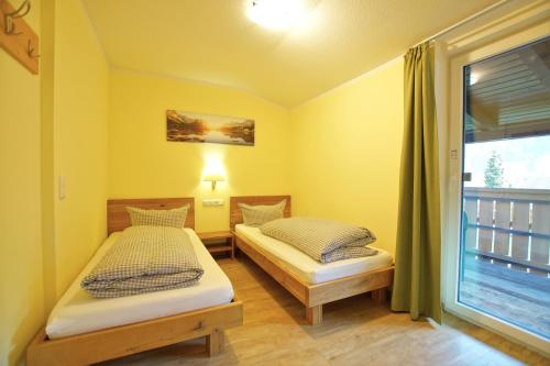 Postel nebo postele na pokoji v ubytování Hotel Waldmann