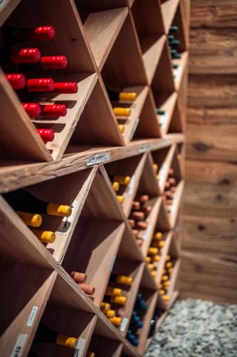 a wine cellar filled with lots of wine bottles at MAD Retreat Hotel in Nendaz