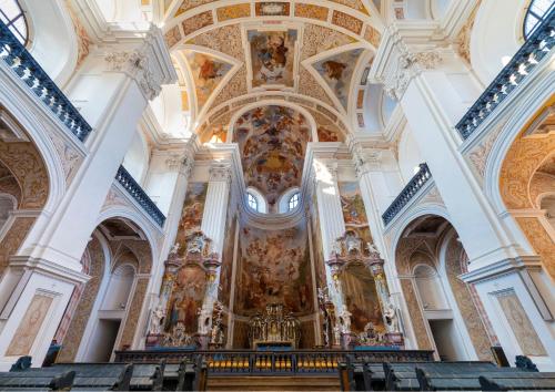 an image of a church with paintings on the ceilings at Tatra Glamp Okrzeszyn - Siec noclegowa Tatra Glamp in Okrzeszyn