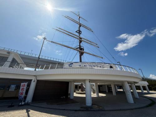 a ship sitting on top of a building at Sanada Maru in Kaizuka
