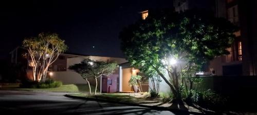 a house with a light on the side of a street at Anyomi Zen in Gqeberha