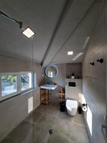 a bathroom with a toilet and a sink at Marina Elegance Apartments in Balchik