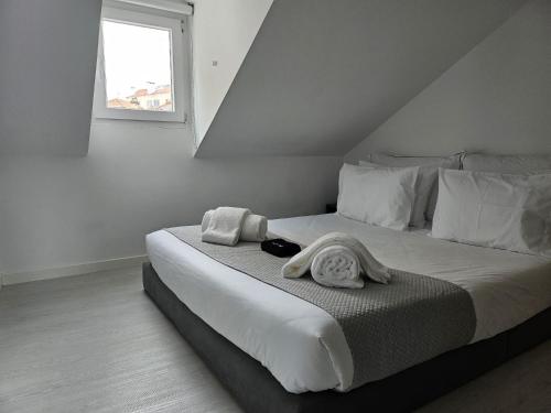 Ένα ή περισσότερα κρεβάτια σε δωμάτιο στο DoTejo Casa