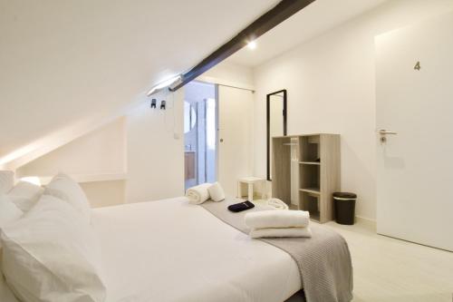Ένα ή περισσότερα κρεβάτια σε δωμάτιο στο DoTejo Casa