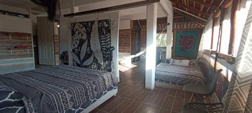 Ένα ή περισσότερα κρεβάτια σε δωμάτιο στο Casa Mazunteña