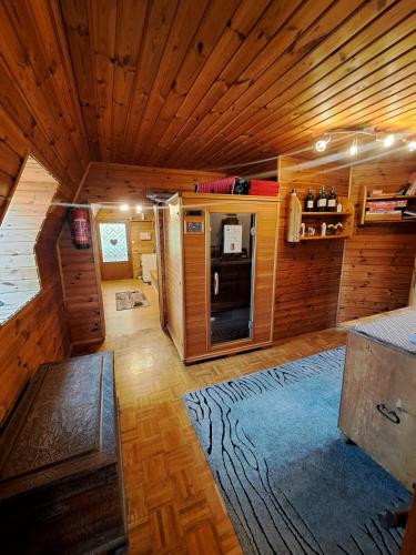 a large room with wooden walls and wooden flooring at BIO-Peisingerhof in Sankt Stefan ob Leoben