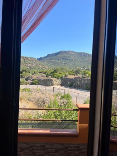a view from a train window of a road at Casa vacanze Sandalia in Bosa