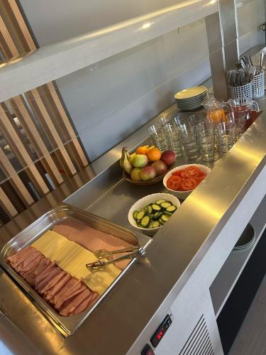 a counter with a bunch of different types of food at Hiiumaa Sõru Puhkemaja in Sõru