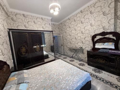 Postel nebo postele na pokoji v ubytování Oʻzbegim