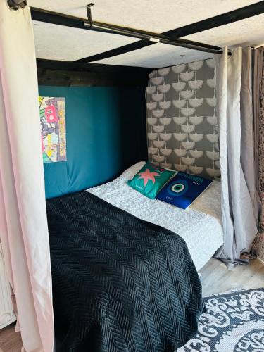 a bedroom with a bed in a bunk bed room at NEW RENOVATED FARM river view Cabin with wood burner pet friendly fire pit bbq in Bramfield