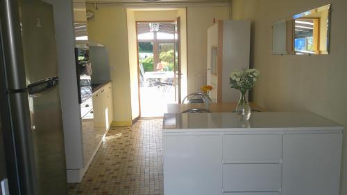a kitchen with a sink and a counter top at Maison entre Cherbourg et Mont Saint Michel in Saint-Aubin-du-Perron