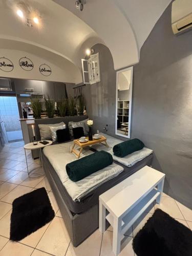 a living room with a couch and a table at Studio Old Town in Maribor