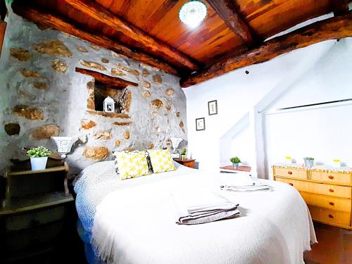 A bed or beds in a room at Petit Nazari