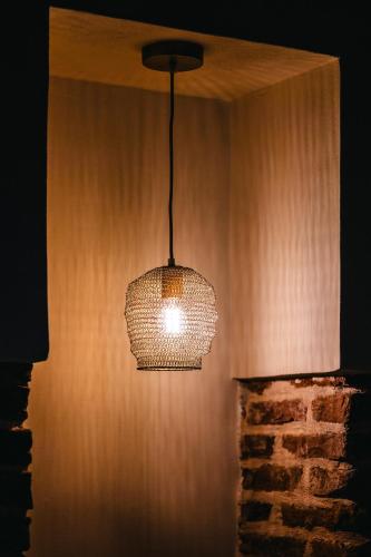 a chandelier hanging from a wall in a room at Casa Victoria in Spigno Monferrato