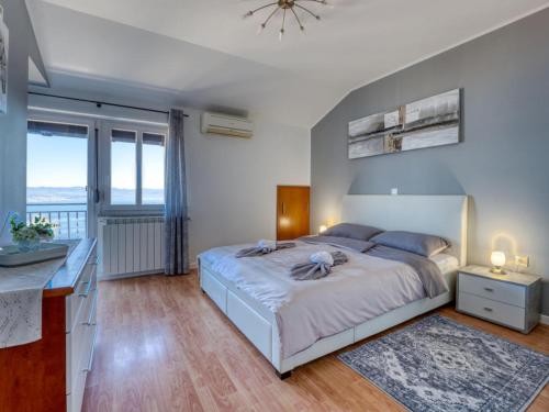 Giường trong phòng chung tại Apartman Ema 2