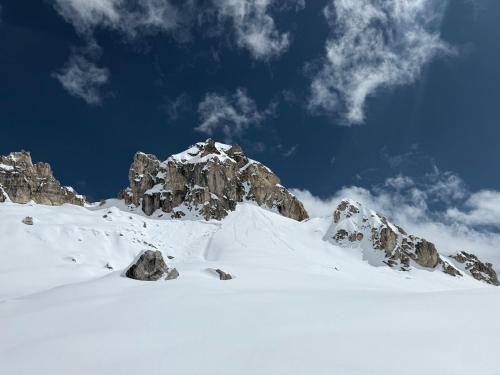 a mountain covered in snow with a mountain at Luxury apartment in Valtournenche in Valtournenche