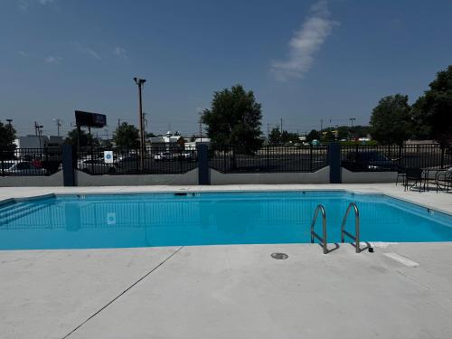 a blue swimming pool with a pair of tongs in it at Quality Inn & Suites in Cincinnati