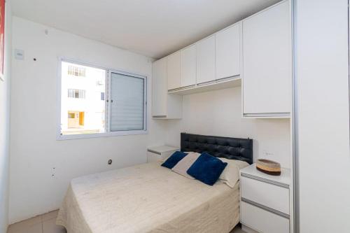 Ένα ή περισσότερα κρεβάτια σε δωμάτιο στο Apartamento girassois com ar condicionado