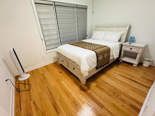 a bedroom with a bed and a window at Best Choice for Travellers in Toronto