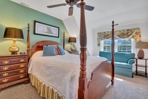 a bedroom with a bed and a ceiling fan at The Winstead Inn in Harwich