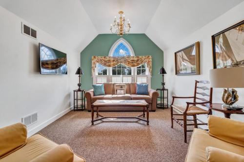 a living room with a couch and chairs at The Winstead Inn in Harwich