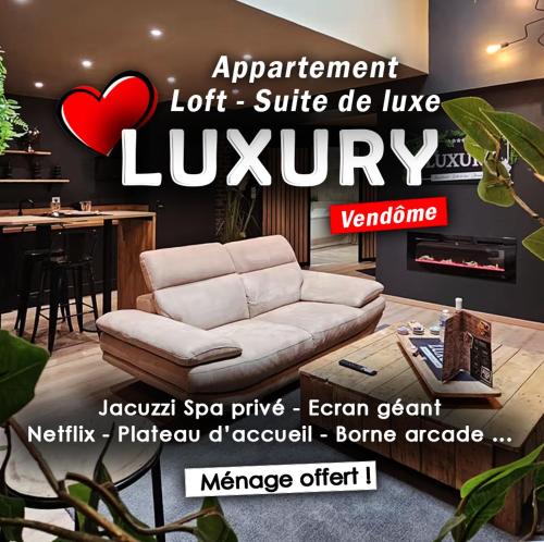 an advertisement for a living room with a couch at LUXURY VENDÔME - Loft - suite de luxe - Jacuzzi - Appartement entier in Vendôme