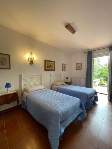 Ένα ή περισσότερα κρεβάτια σε δωμάτιο στο Villa Filippo