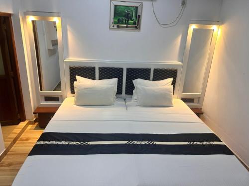 Postel nebo postele na pokoji v ubytování Grand Residence