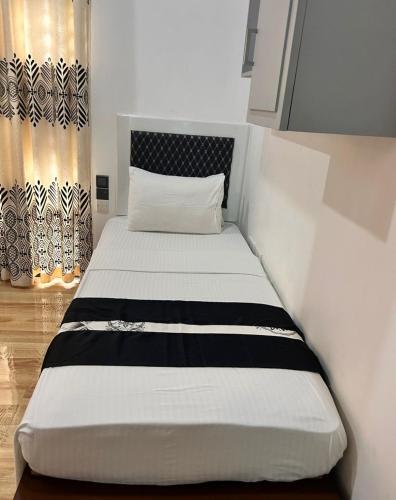 Postel nebo postele na pokoji v ubytování Grand Residence
