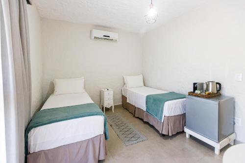 Postel nebo postele na pokoji v ubytování Filimahalo Hotel
