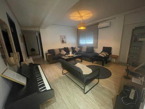 an aerial view of a living room with a piano at Les Nuits de Miel - Marrakech in Marrakech