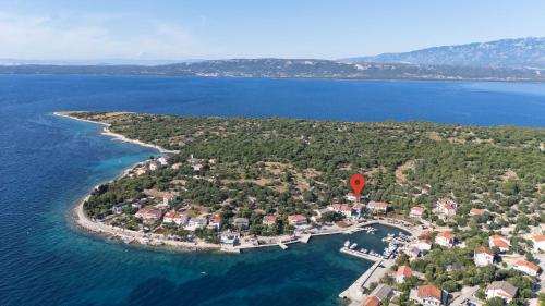 an island in the water with a hot air balloon at Luxury apartments Lun in Lun