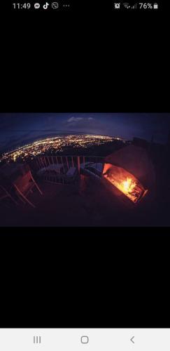 a view of a city at night from an airplane at Terasa LIDO in Skopje