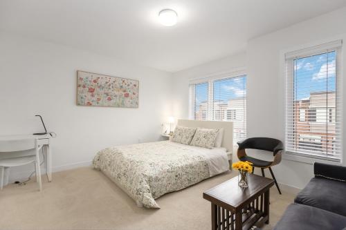 a bedroom with a bed and a desk and a chair at SPRUCE Private Suite with attached Full Bathroom in Toronto, Canada in Toronto