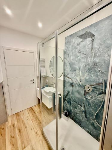 a bathroom with a shower and a toilet at La Zisa Luxury Apartment in Palermo