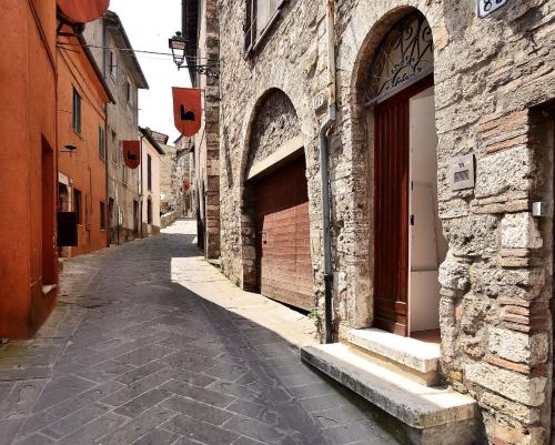 an alley with two entrances to a stone building at Domus Santa Maria in Narni