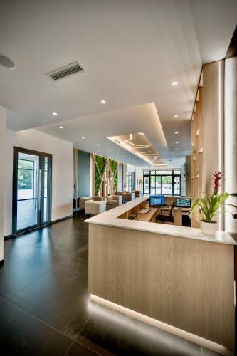 an office lobby with a large reception desk at Aura in Loznica