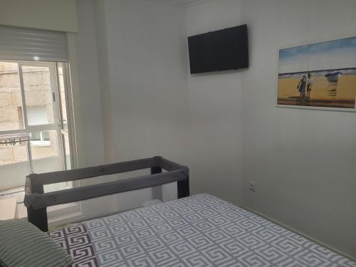 Μια τηλεόραση ή/και κέντρο ψυχαγωγίας στο Silgarbeach Apartamento