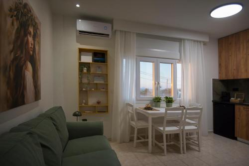 a living room with a couch and a table at casa NEFELI in Karteros
