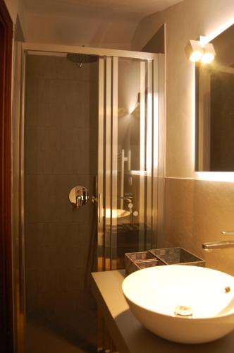 a bathroom with a sink and a shower at Palazzina Storica al Mare, Rapallo in Rapallo