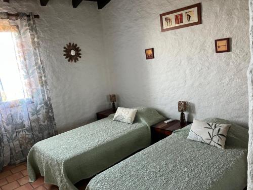 Postel nebo postele na pokoji v ubytování Villa Ascopa