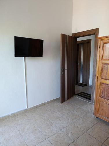 a room with a flat screen tv on the wall at Villa Serenita in Ulcinj