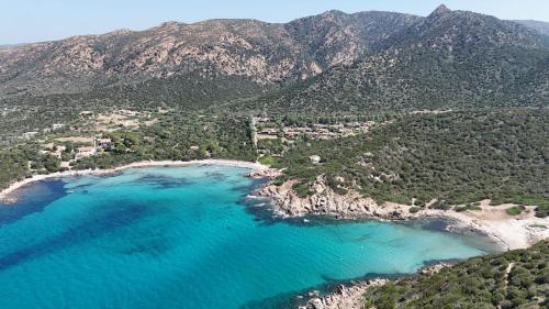 an aerial view of a beach with blue water at Holiday House Gioia in Chia