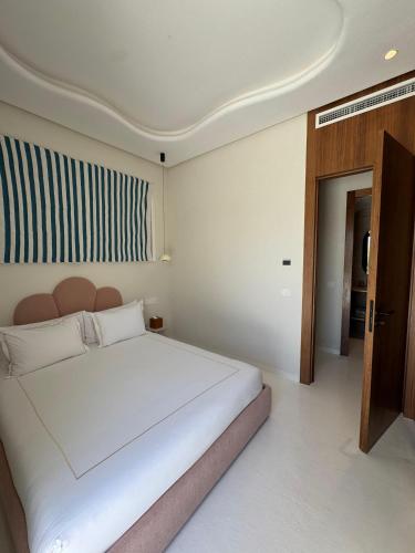 Ein Bett oder Betten in einem Zimmer der Unterkunft Yin Hotel & Spa