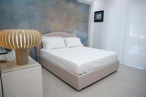 L'Approdo Suite Apartmentsにあるベッド