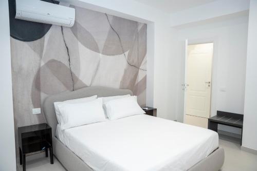 L'Approdo Suite Apartmentsにあるベッド