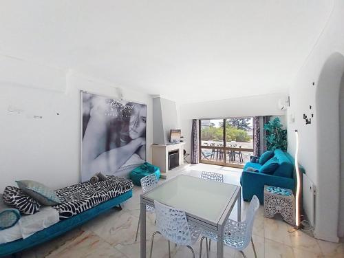 a living room with a couch and a table at OURA WHITE VIEW Beach 2 min walk sea in Albufeira