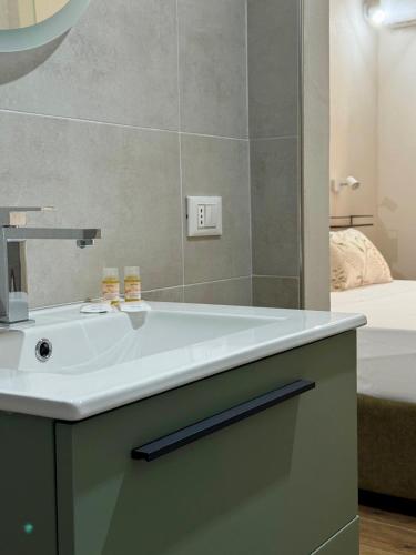 a bathroom with a sink and a mirror at Matri Mia in Trapani