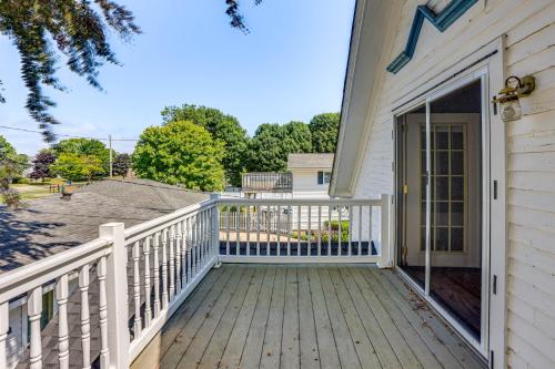 a front porch of a house with a white fence at Walk to Lake Michigan and Dtwn Coastal Grand in Ludington