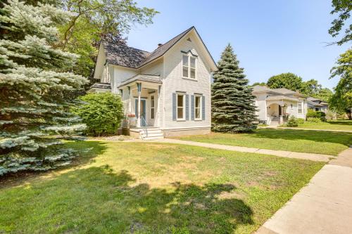 a white house with a yard and trees at Walk to Lake Michigan and Dtwn Coastal Grand in Ludington